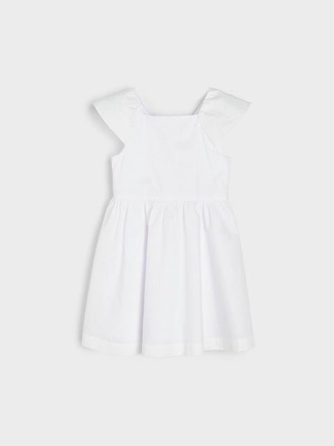 White sleeveless top on a light gray background