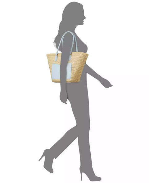 Silhouette of a woman holding a straw handbag on a white background