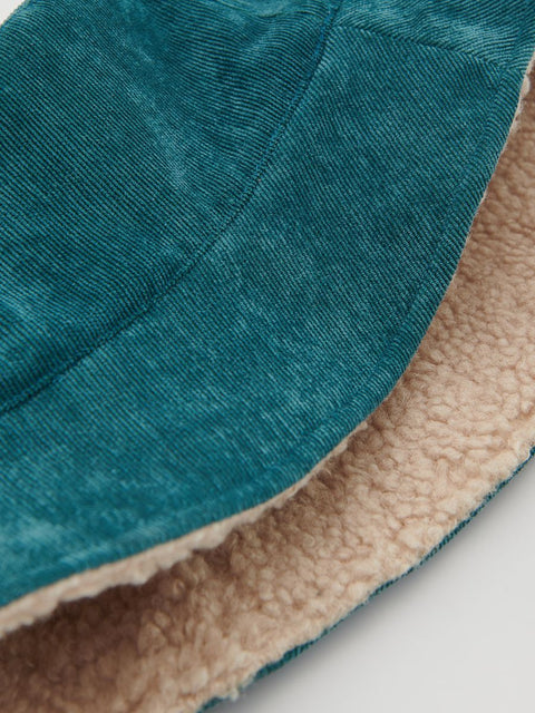 Close-up of teal and beige fabric texture