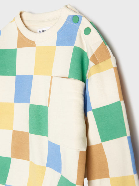 Colorful checkered sweater with a plain background