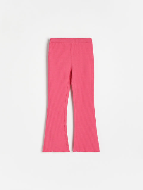 Pink ribbed pants on a white background