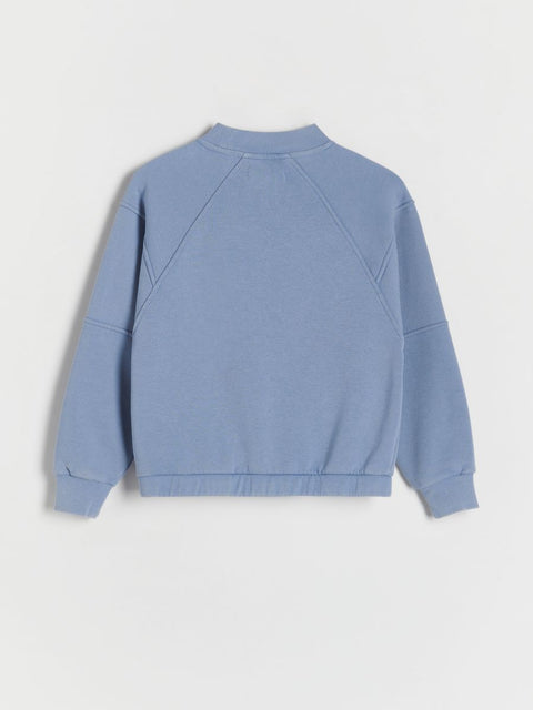 Blue sweatshirt on a light gray background