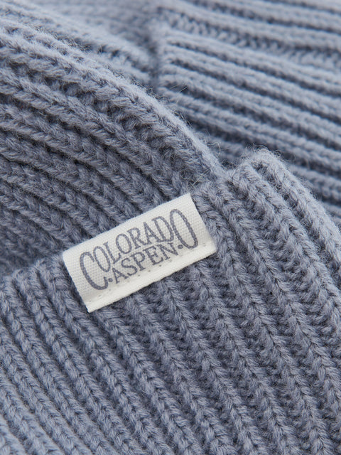 Close-up of a gray knit beanie with 'Colorado Aspen' label.
