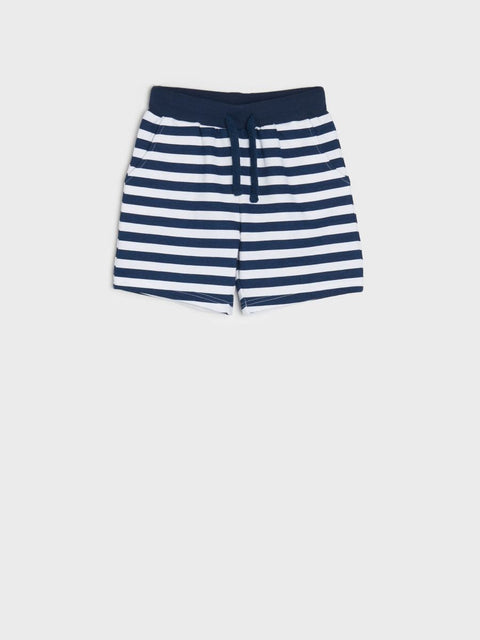Navy and white striped shorts on a light gray background
