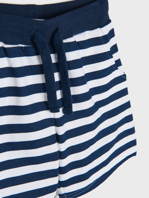 Navy and white striped shorts with a drawstring on a light gray background