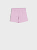 Pink shorts on a light gray background