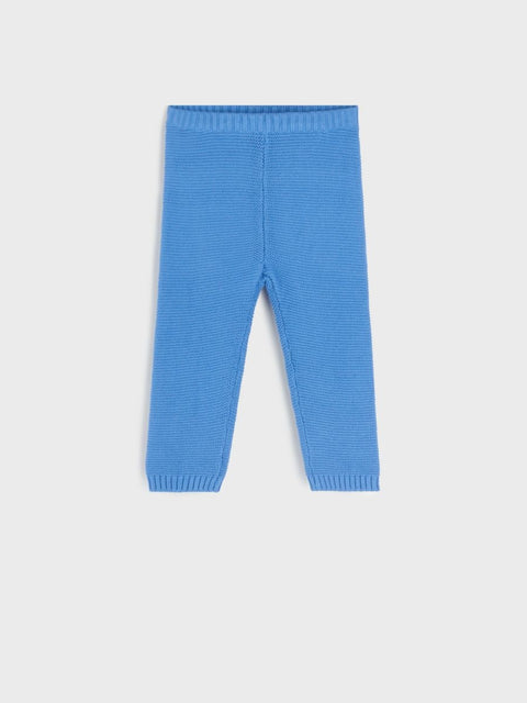 Blue ribbed leggings on a light gray background