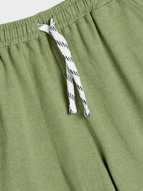 Green pants with a drawstring on a white background