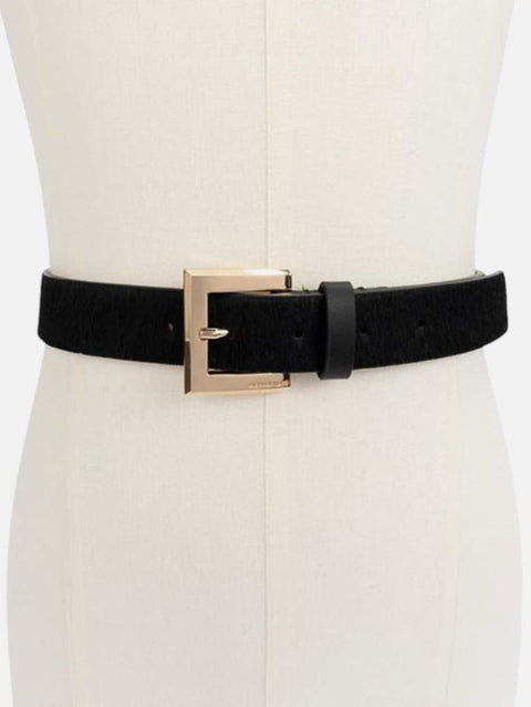 Black belt with a gold buckle on a mannequin against a white background