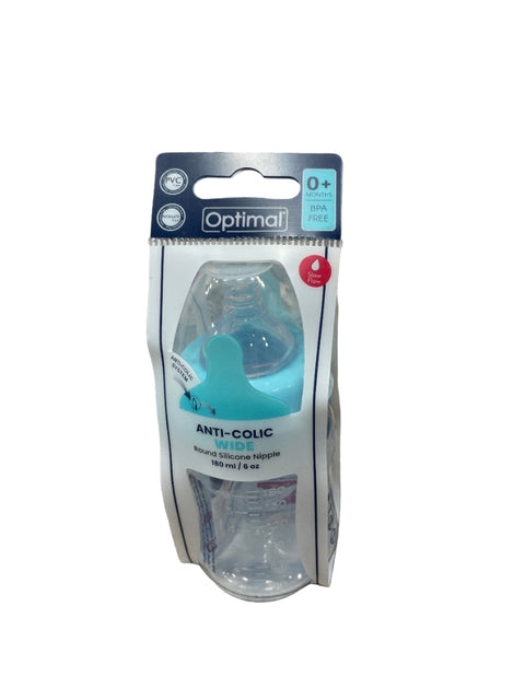 Baby pacifier packaging on a textured surface