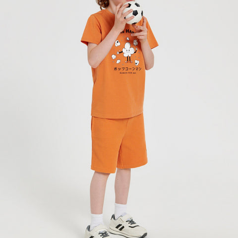 Person wearing an orange outfit with a cartoon character on a white background