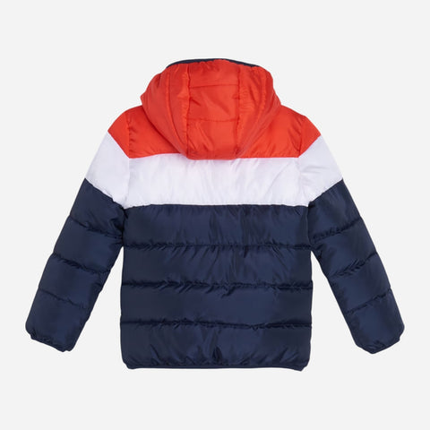Puffer jacket with red hood and navy lower half on a white background
