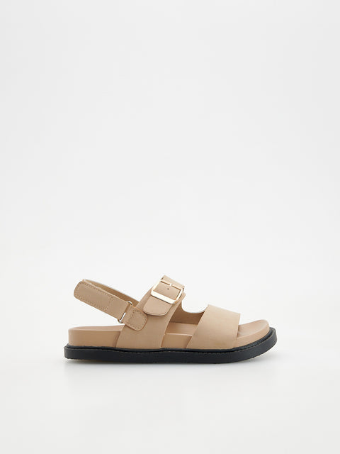 Beige sandal with a buckle on a white background