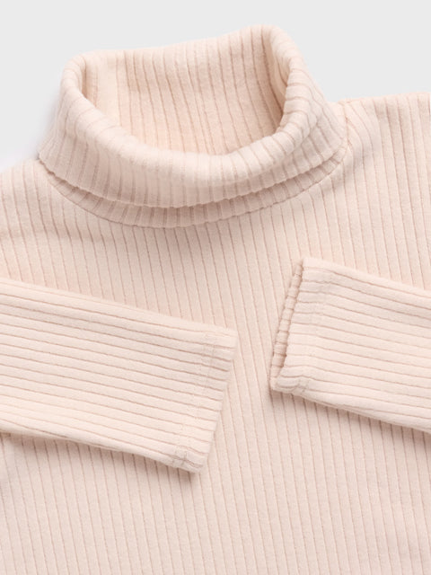 Close-up of a ribbed pink sweater with a collar on a light gray background