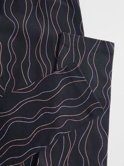 Black fabric with wavy pink lines on a white background