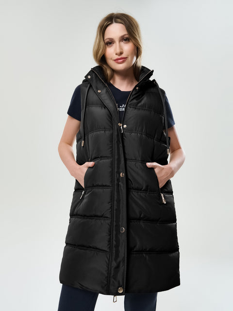 Woman wearing a black puffer vest on a white background