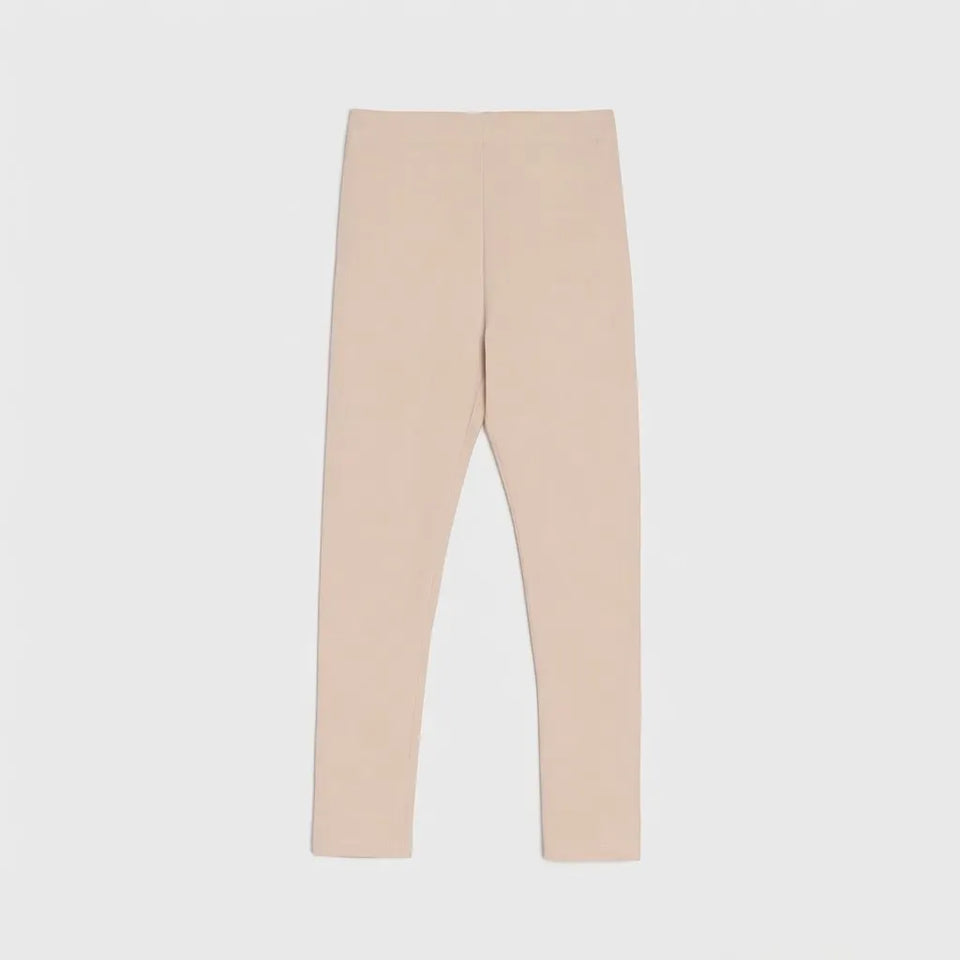 A pair of light beige leggings shown flat against a light gray background.
