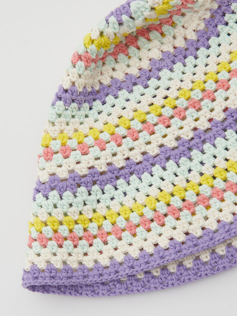 Colorful crocheted blanket with a pattern on a white background