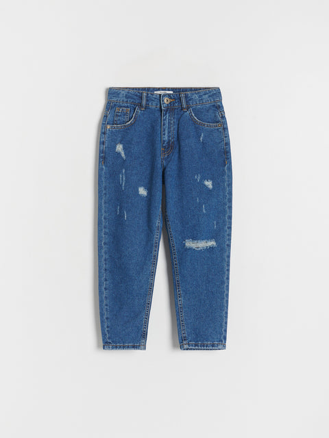 Blue jeans with slight distressing on a white background