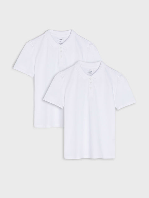 Two white polo shirts on a light gray background