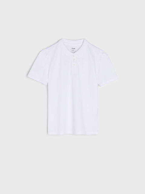White polo shirt on a light beige background