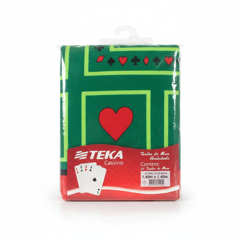 Packaged green towel with red heart design and Teka branding on a wooden surface
