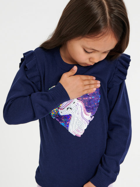 Child wearing a navy blue sweatshirt with a unicorn design on a white background