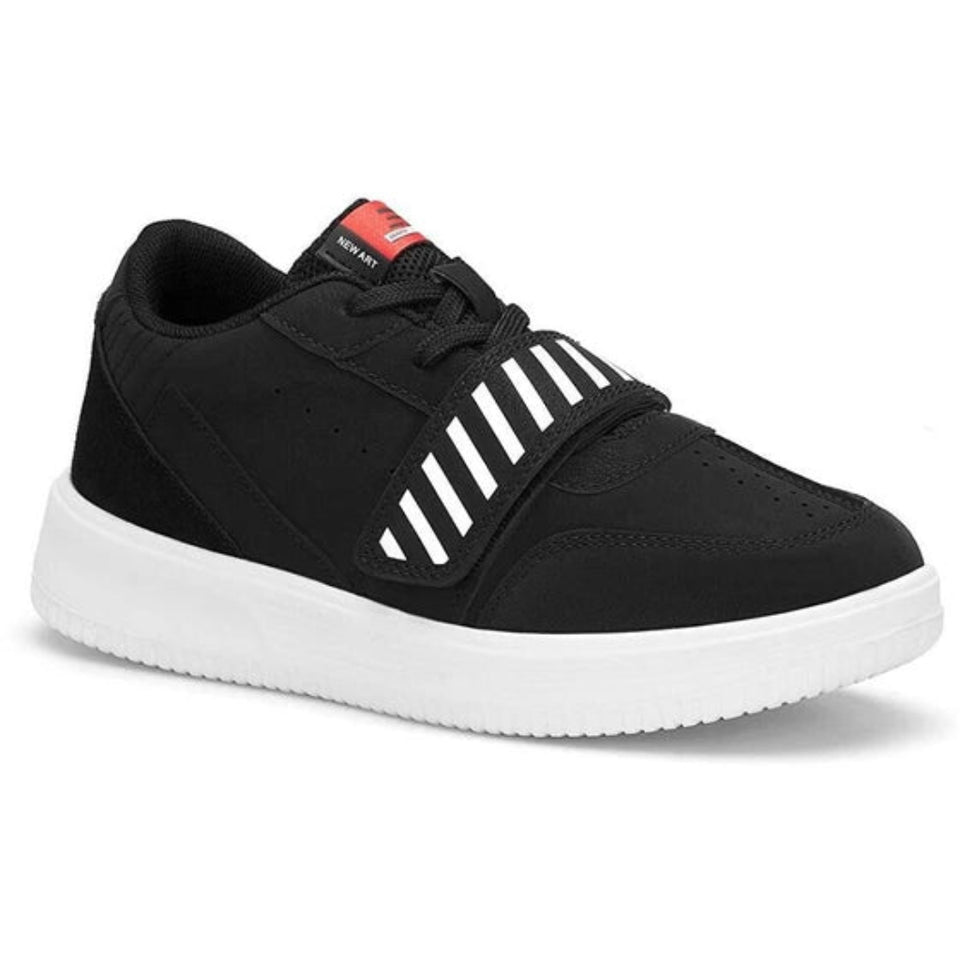 A black low-top sneaker with a thick white platform sole, featuring white diagonal stripes on the side and a red tongue label.