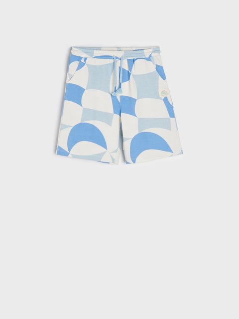 Shorts with a blue and white geometric pattern on a light gray background