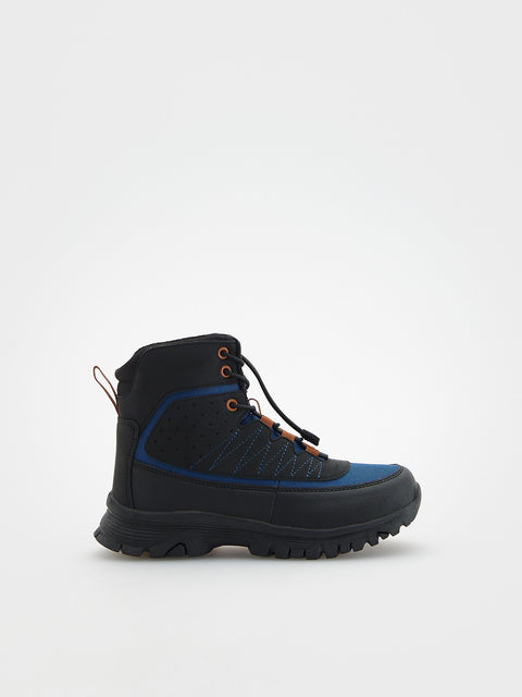 Black and blue hiking boot on a white background