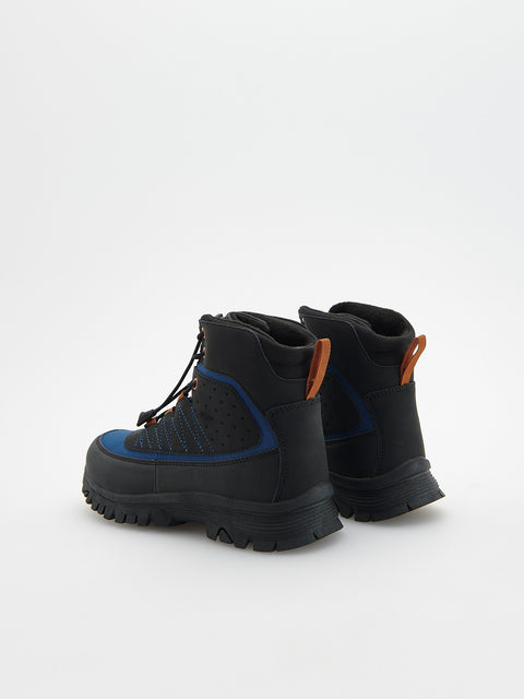 Black hiking boots with blue accents on a white background