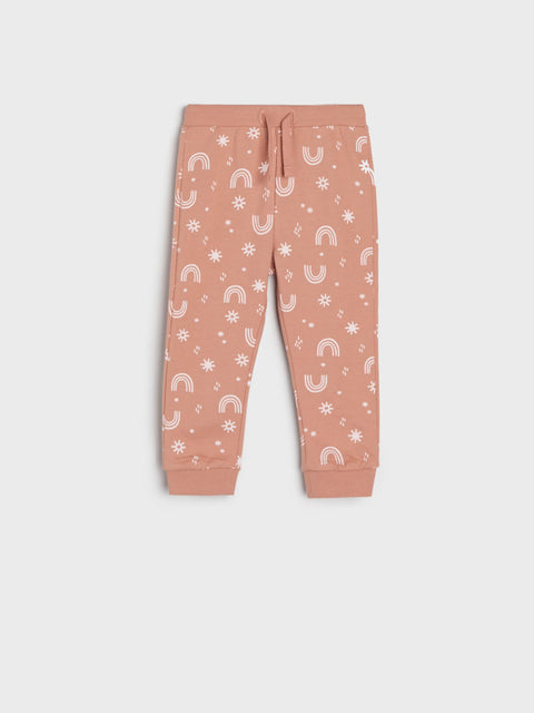 Pink children's jogger pants with white pattern on a white background
