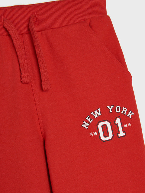 Red sweatpants with 'New York 01' text on a white background