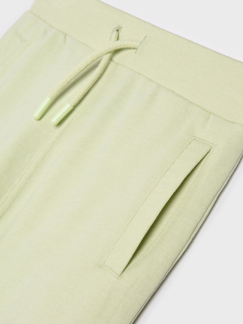 Light green pants with a drawstring on a white background