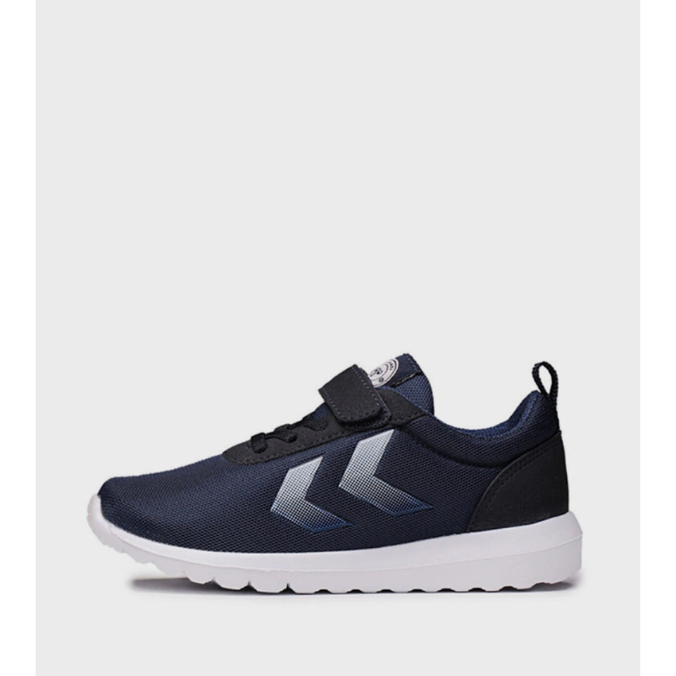 A navy blue athletic sneaker with a hook-and-loop strap closure, a white sole, and a silver chevron logo on the side, shown against a light gray background.