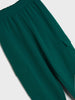 Close-up of green pants on a light gray background