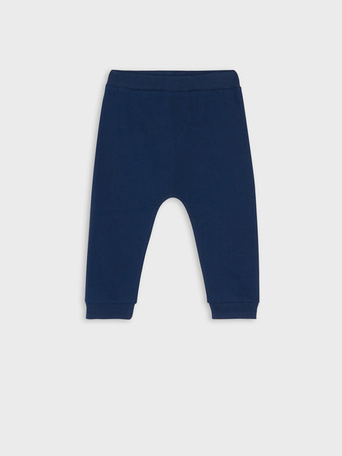 Navy blue baby pants on a light gray background