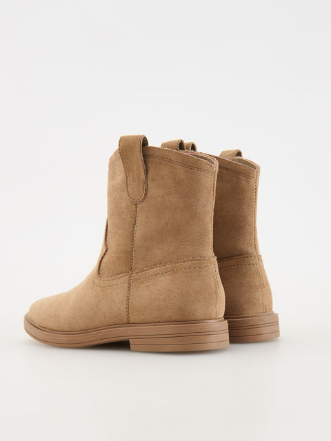 Pair of tan suede boots on a white background