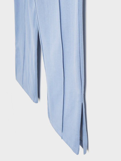 Light blue scarf draped over a white background