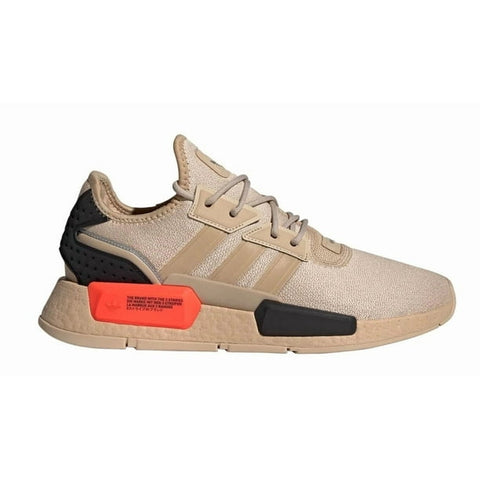 Beige sneaker with black and red accents on a white background