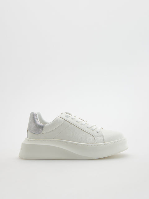 White sneaker on a light gray background