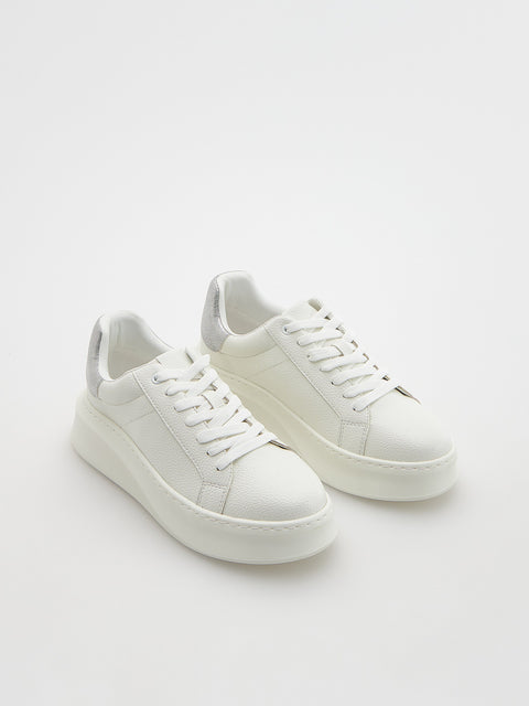 White sneakers on a white background