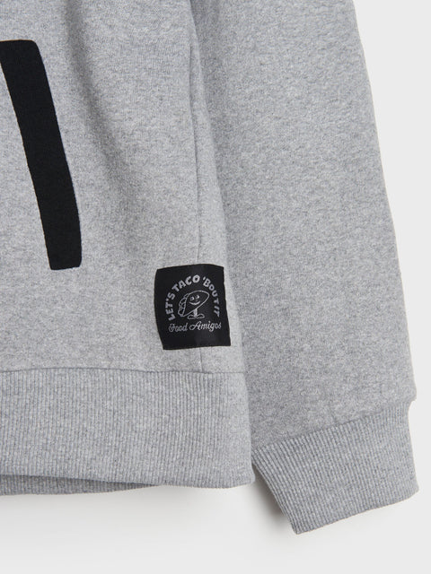 Gray sweatshirt with a black logo patch on a white background