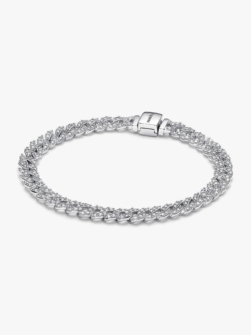 Silver bracelet with clear stones on a white background