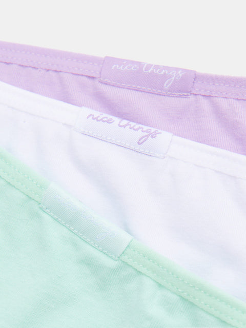 Close-up of a colorful fabric with 'nice thing' branding.