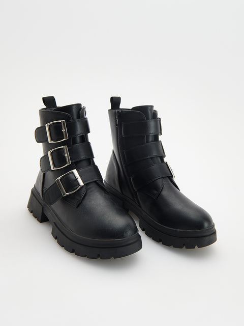Black leather boots with buckles on a white background