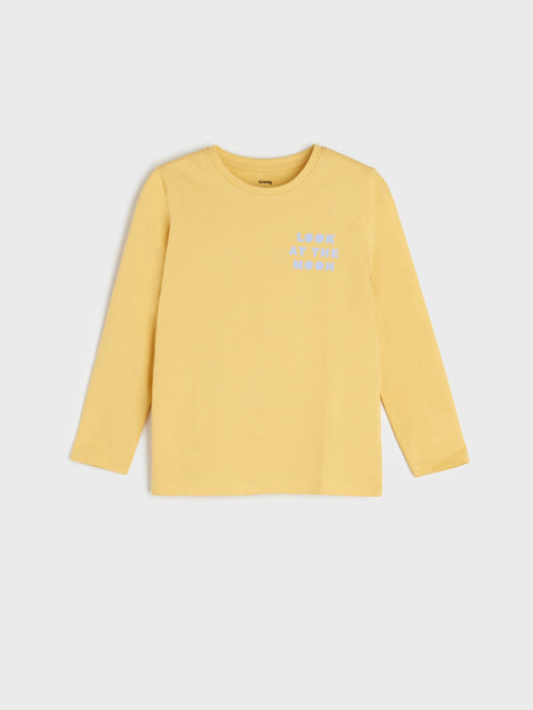 Yellow long-sleeve shirt with text on a light gray background