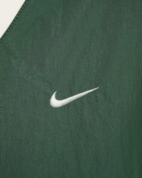 Nike Women's Green Sportswear Essential Loose UV Woven Long-Sleeve V-Neck Blouse | Nike In Lebanon