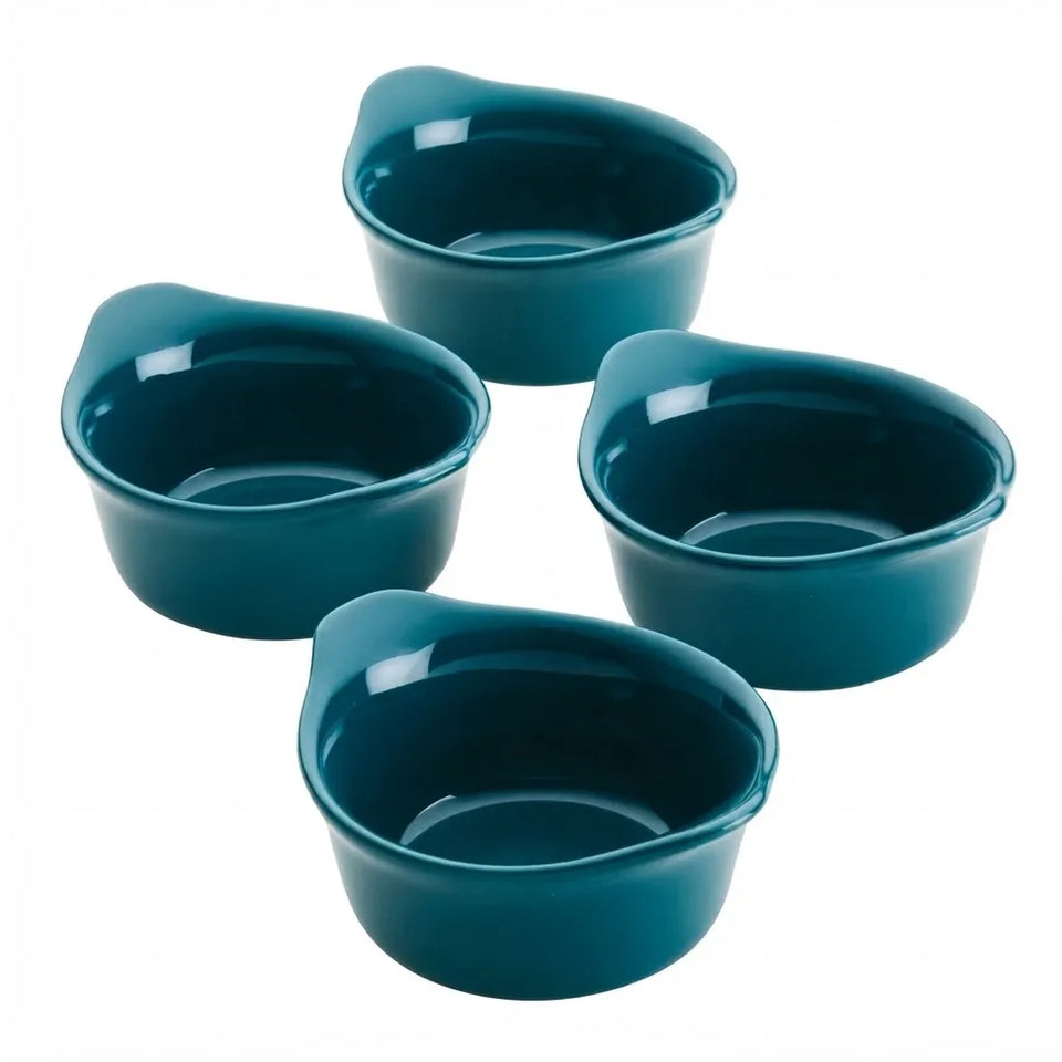 Four small teal ceramic bowls with integrated handles, arranged on a plain white background.