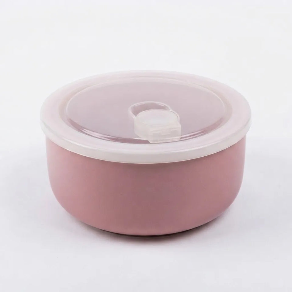 A round pink container with a matching translucent pink lid and a small flip-up tab, photographed on a clean white background.